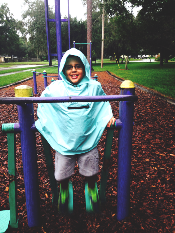 Playing at the park in Roo Rain Gear rainwear made from RPET